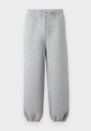 Pantalon de survêtement gris clair avec taille élastique, cordon ajustable et poignets élastiques.