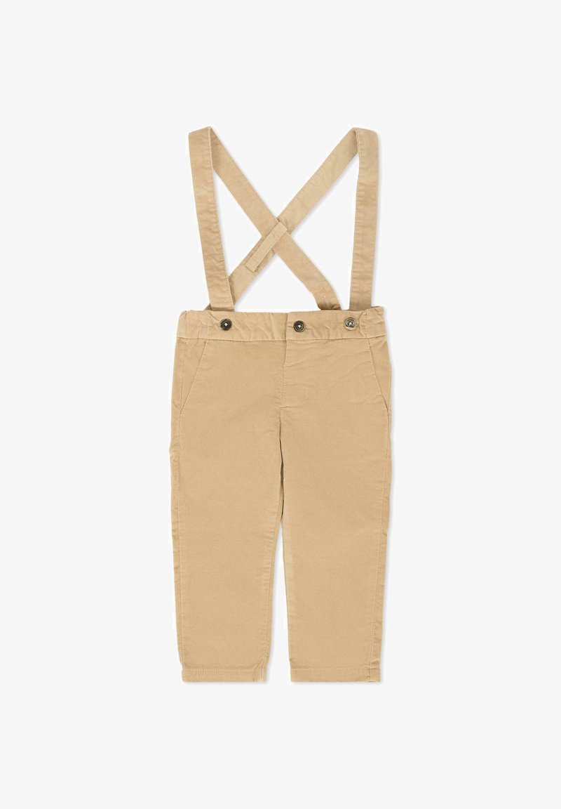 Pantalon en coton beige avec des bretelles croisées ajustables, des poches avant et deux boutons à l'avant. Coupe droite avec une texture lisse.