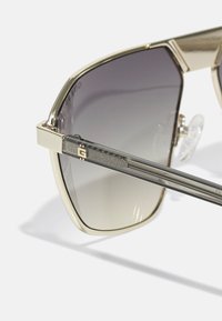 Guess UNISEX - Aurinkolasit - gold-coloured