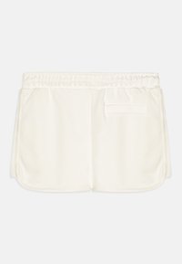 Hvite, teksturerte bomullsshorts med elastisk midje og baklomme. Har løs passform og avrundede sømmer.