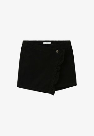 Shorts en velours côtelé noir avec une bordure à volants, une fermeture à bouton à l'avant, et un design légèrement asymétrique avec une texture lisse.