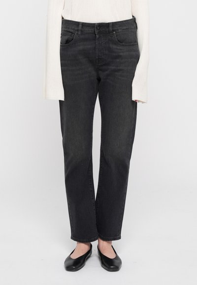 Zwarte denim jeans met een rechte pasvorm, vijf zakken en een strakke uitstraling. Gemaakt van katoen met lichte textuurvariaties.