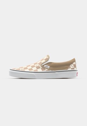 Beige- und cremefarbene kariert Slip-On-Schuhe mit einem glatten Obermaterial und einer weißen Gummisohle. Merkmale sind ein gepolsterter Kragen und das Vans-Logo.