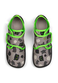 Gray fabric shoes featuring black cat and ghost patterns, with green trim and Velcro closures, rounded toe, and black soles.