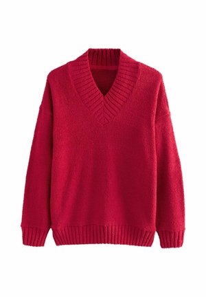 Rød v-hals sweater lavet af struktureret stof. Har ribbede manchetter og søm, med en løs pasform og brede ærmer.