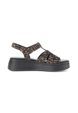 Brown and black leopard print sandal with thick black platform sole and adjustable Velcro strap at heel.