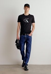 Calvin Klein Jeans OUTLINE MONOLOGO TEE - T-shirts print - black