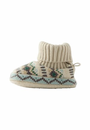 Stivaletti lavorati a maglia beige con polsino a coste, decorati in teal e marrone, dotati di una suola morbida e di un anello sul retro per facilitare l'indossamento.