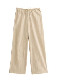 Beige vida byxor i lätt material, med resårmidja och snörning, samt en mjuk, texturerad yta.