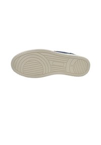 Shoe sole in light beige, featuring a textured pattern with grooves and ridges for traction. Smooth edges, designed for comfort and durability.