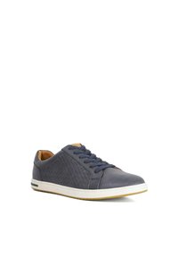 Navy leather sneakers featuring textured side panels, white rubber sole, round toe, and lace-up design with blue laces.