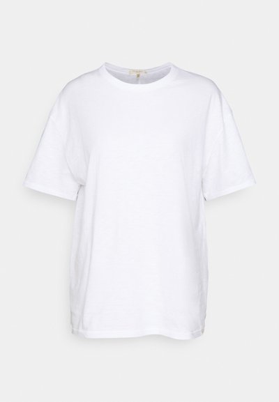 Vitt kortärmat t-shirt i bomull. Har rund hals och avslappnad passform med en slät yta och inga synliga mönster eller detaljer.