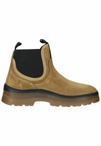 Tanfarbene Wildleder-Stiefelette mit elastischen Seitenteilen, schwarzen Akzenten und einer Gummisohle mit strukturiertem Muster für besseren Halt.