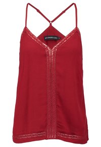 Caraco rouge sans manches avec fines bretelles ajustables, encolure en V et bordure en dentelle brodée au centre et le long de l'ourlet.