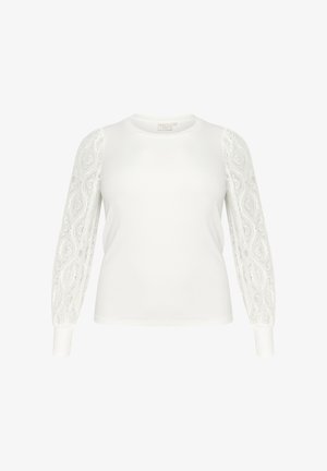 Fehér, hosszú ujjú felső, egyszínű testtel, csipkés ujjal, kerek nyakkivágással és szűkített mandzsettákkal. Könnyű, puha szövetből készült.