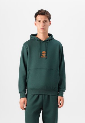 Dark green hoodie made of soft fabric, featuring a front pocket, ribbed cuffs, and an embroidered logo in orange. Stitched seams are visible.