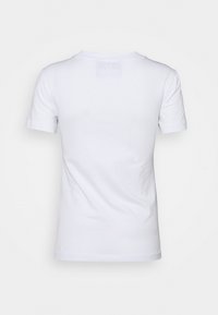 Biała koszulka z krótkim rękawem, okrągłym dekoltem, gładką fakturą i bez widocznych grafik czy wzorów. Widok z tyłu ukazuje czysty krój.