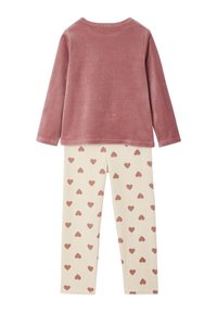 Two-piece lounge set featuring a soft, pink long-sleeve top and cream leggings with scattered rose-colored heart patterns.