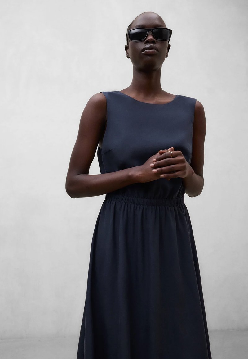 navy blue dress on dark skin bottega veneta