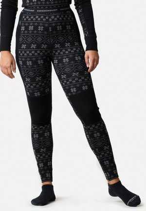 Leggings noirs avec un motif hivernal gris, comprenant des flocons de neige et des diamants. Fabriqués à partir d'un matériau doux avec un design ajusté.
