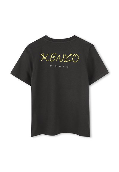 T-shirt en coton noir avec 'KENZO' en jaune vif et 'PARIS' en blanc imprimé au dos, avec un col rond classique et des manches courtes.