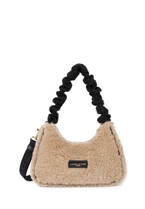 Beige faux fur handbag with a soft texture, black scrunched handle, and gold hardware. Features a rectangular shape and brand label.