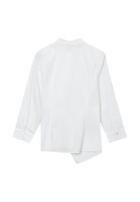 White long-sleeved shirt featuring a pointed collar, back yoke, and a slightly asymmetrical hem. Smooth fabric with buttoned cuffs.