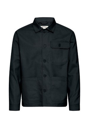 Sort arbejdsjakke lavet af robust stof. Har krave, knapper foran, en brystlomme og to lavere lommer til værktøj.
