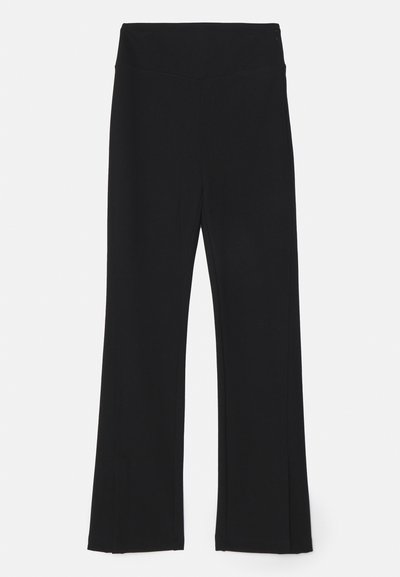 Black flared leggings with a high waistband, made of stretchy material. Smooth texture with no visible patterns or hardware details.