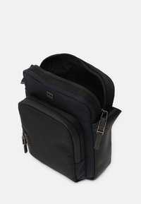 Tommy Hilfiger COMMUTER MINI REPORTER - Umhängetasche - space blue