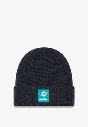 Dark navy knit beanie with a folded cuff, featuring a teal Miami Dolphins logo patch on the front. Textured ribbed pattern throughout.