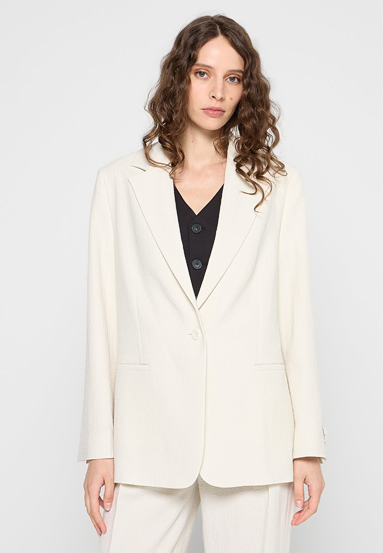 Hellcreme maßgeschneiderte Blazer mit strukturiertem Finish, mit Schalkragen, einem Knopfverschluss und zwei Fronttaschen.