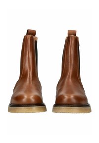 Bottes Chelsea en cuir marron avec des panneaux latéraux élastiques, bout rond et semelle en caoutchouc naturel. Surface lisse avec des accents minimalistes.