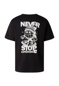 Black T-shirt with white graphic of a walking globe wearing a beanie and boots, text reads "Never Stop Exploring" and The North Face logo.