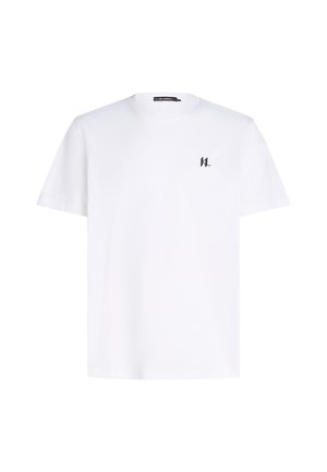 T-shirt bianco a maniche corte con un piccolo logo nero nella parte sinistra del petto, presentato su uno sfondo neutro.