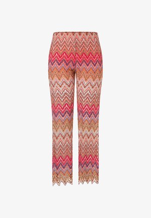 Pantalons en tricot multicolores avec un motif en zigzag dans des nuances de rouge, rose, violet et orange, avec une coupe ajustée et un ourlet évasé.
