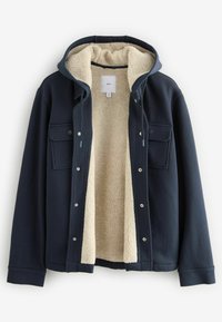 Navy blue jacket with a soft cream fleece lining, front snap closures, two chest pockets, and a hood. Textured exterior with a cozy design.