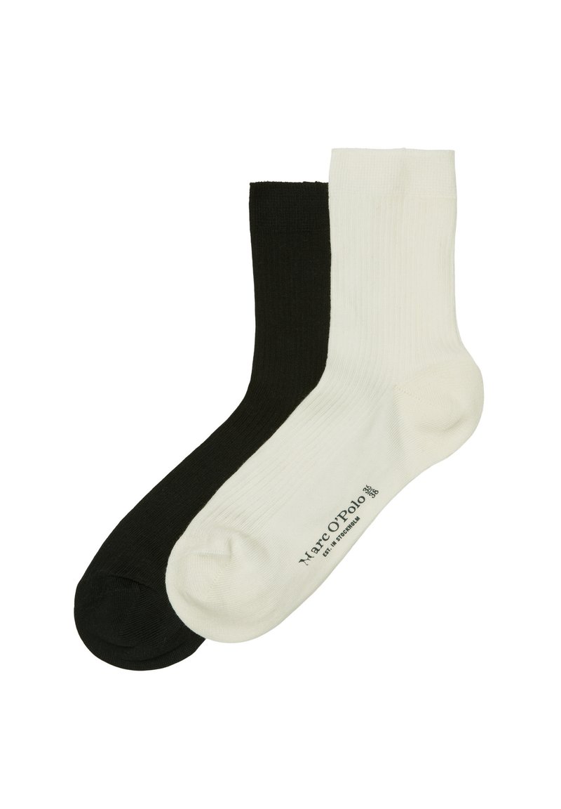 Bawełniane skarpetki w czarno-białym kolorze, o żebrowanej fakturze, długości do połowy łydki. Posiadają nadruk logo w pobliżu kostki na białej skarpetce.