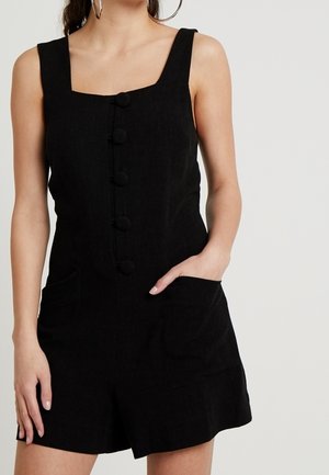 Zwarte linnen jumpsuit met een vierkante halslijn, knopen aan de voorkant, twee zijzakken en eenRelaxte pasvorm met shorts.