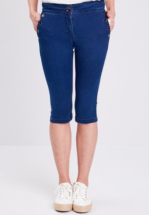 Denim capri's in donkerblauw met een mid-rise taille, decoratieve zijknopen en een cropped lengte die net onder de knie eindigt.