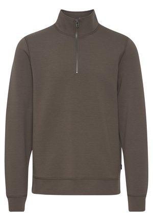 Quarter-zip pullover in dark olive green, made of soft fabric. Features a high collar, long sleeves, and a ribbed hem. Zip closure at neck.