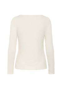 Long-sleeve top in off-white, featuring textured floral pattern, round neckline, and fitted silhouette. Soft fabric with slight stretch.