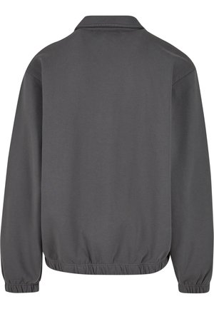 Sweatshirt gris avec col, poignets et ourlet élastiques. Texture lisse, coupe décontractée et design minimaliste sans logos visibles.