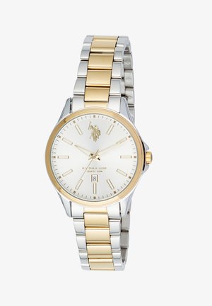Montre-bracelet U.S. Polo Assn. avec bracelet métallique doré et argenté, cadran blanc, index dorés, affichage de la date et logo à 12 heures.