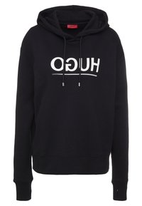 Felpa nera realizzata in morbido tessuto, con un grande logo bianco "HUGO". Include un cappuccio e lacci con estremità metalliche.