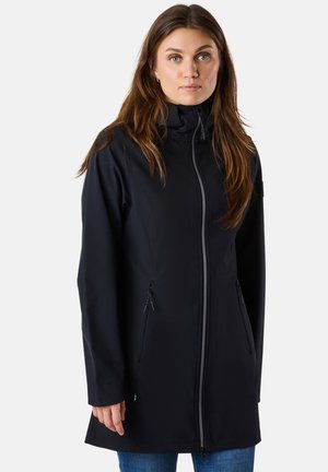 Black softshell jacket with a high collar, front zipper, and two side pockets. Smooth texture with a fitted silhouette and long sleeves.