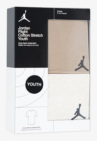Lot de deux débardeurs pour jeunes avec col rond, en beige et blanc cassé, en tissu extensible coton, ornés d'accents du logo Jumpman en noir.