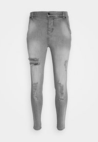 Smaljeans i ljusgrå denim med slitna revor på låren, fem fickor och en knäppning i midjan.