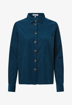 Granatowa koszula z korduroyu zapinana na guziki, z kołnierzykiem, siedmioma brązowymi guzikami i kieszonką na piersi. Długie rękawy z mankietami zapinanymi na guziki. Miękka faktura.