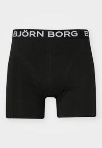 Black boxer briefs made of soft fabric, featuring a snug fit, contrasting elastic waistband with "BJÖRN BORG" in white text, and no patterns.